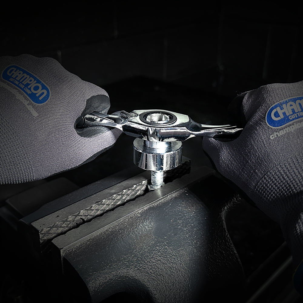 Close-up of Champion carbon steel taps and dies for thread cutting